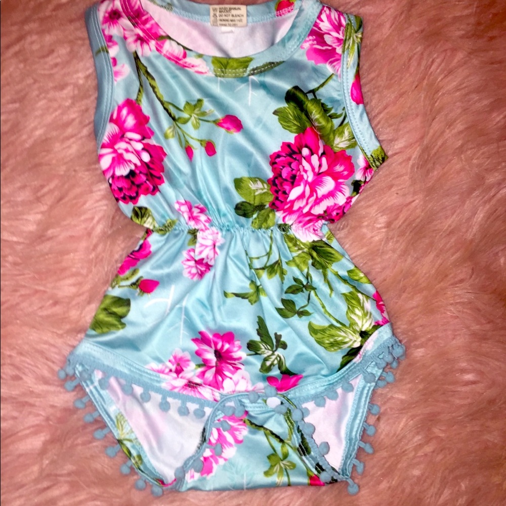 Two silk material baby onesies with Pom poms